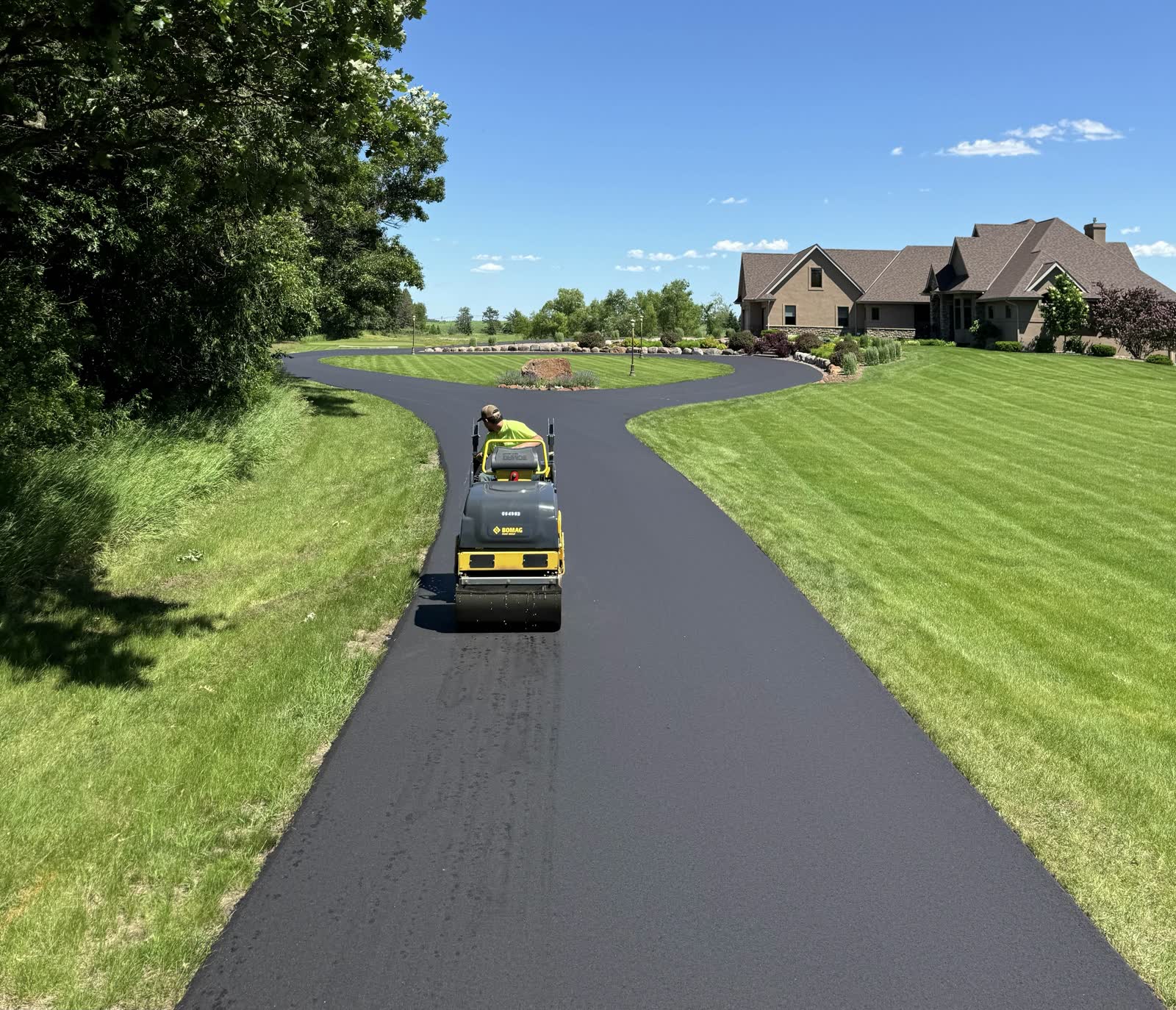 BC Paving roller compacting a fresh asphalt driveway